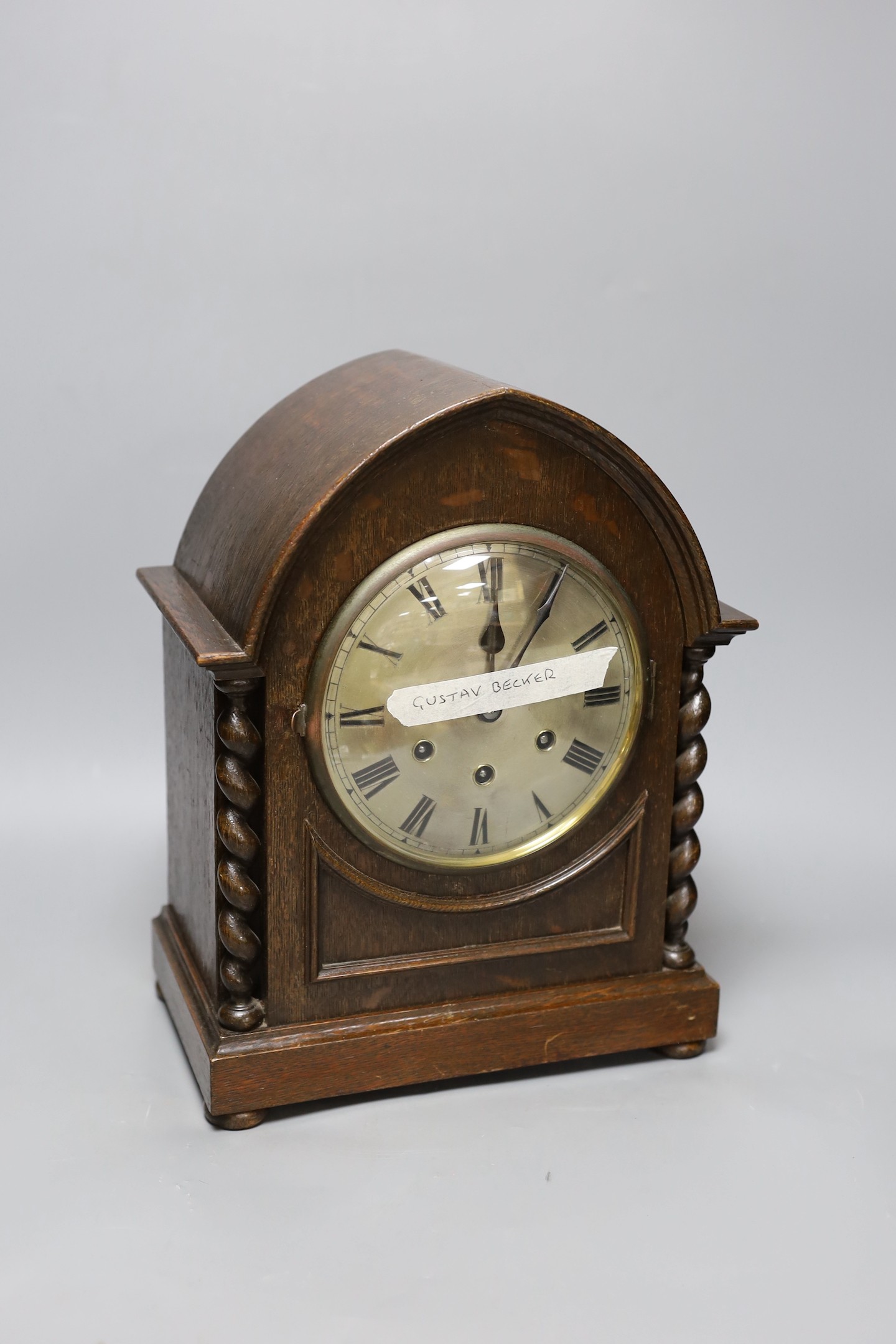 An oak cased chiming bracket clock, 34.5 cm high